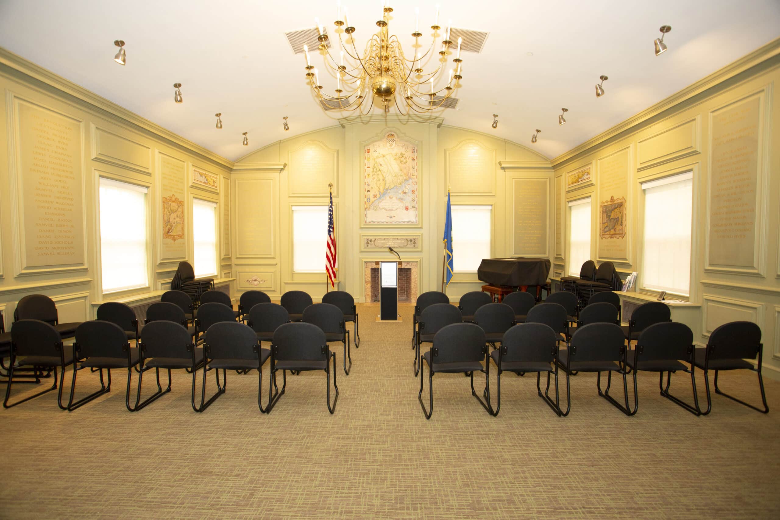 image of memorial room with two sections of chairs in rows separated by a center aisle